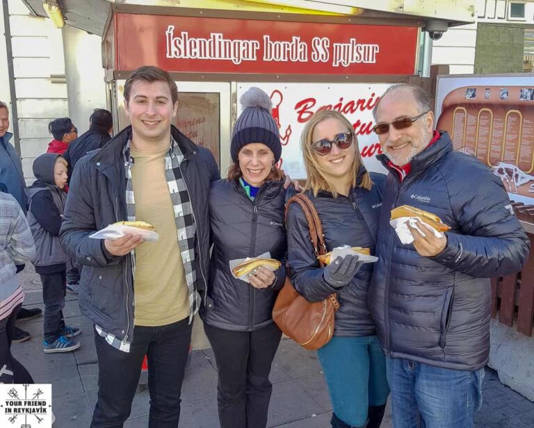 Family experiencing Icelandic hot dogs on our private Reykjavik Food Tour