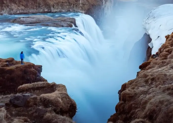 Tourists enjoying Gullfoss waterfall during summer in Iceland