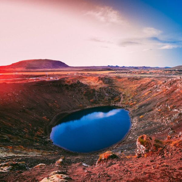 The reds of Kerid Crater in Iceland can be seen on a bright sunny day