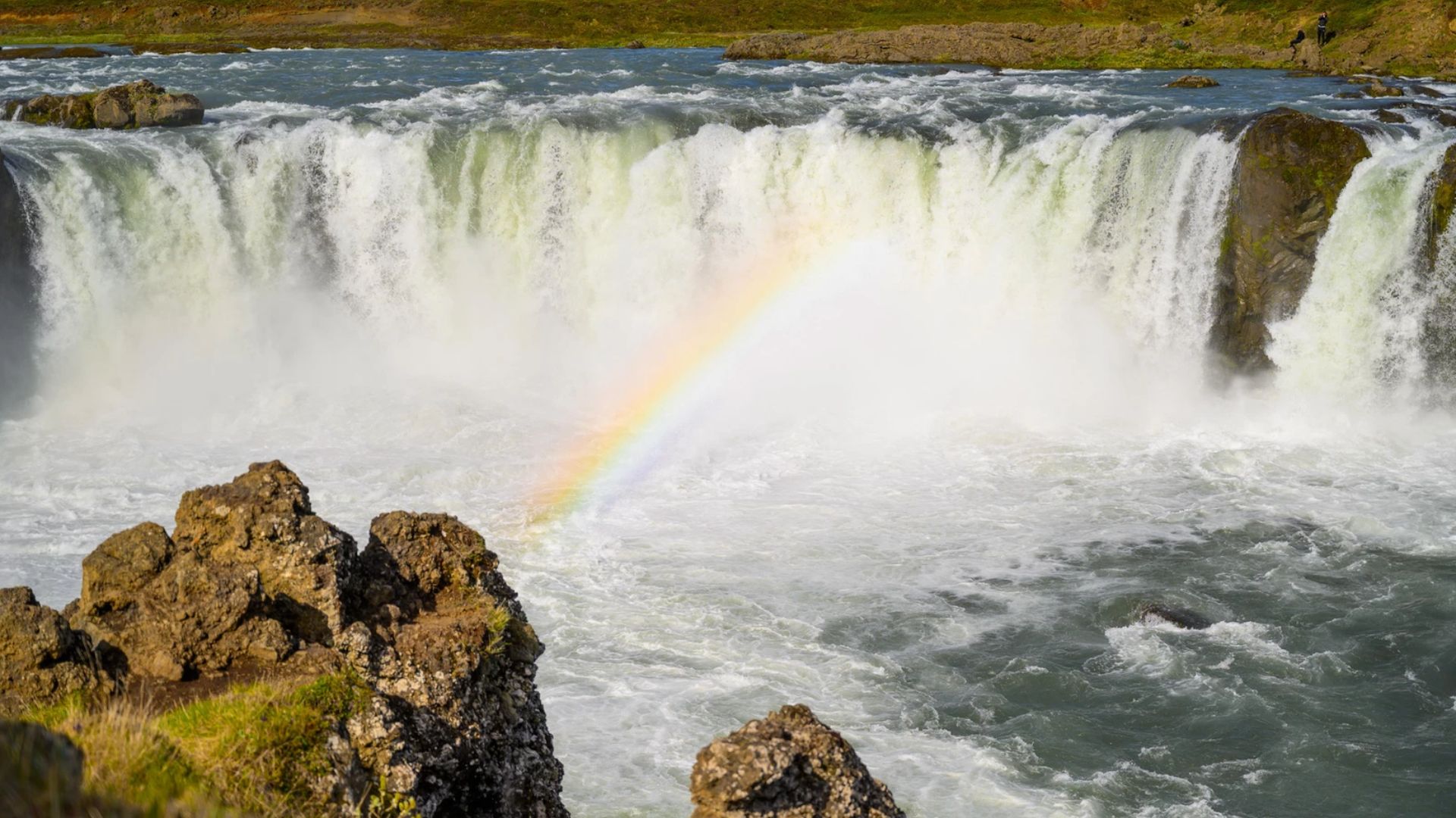 Godafoss waterfall with rainbow in North Iceland