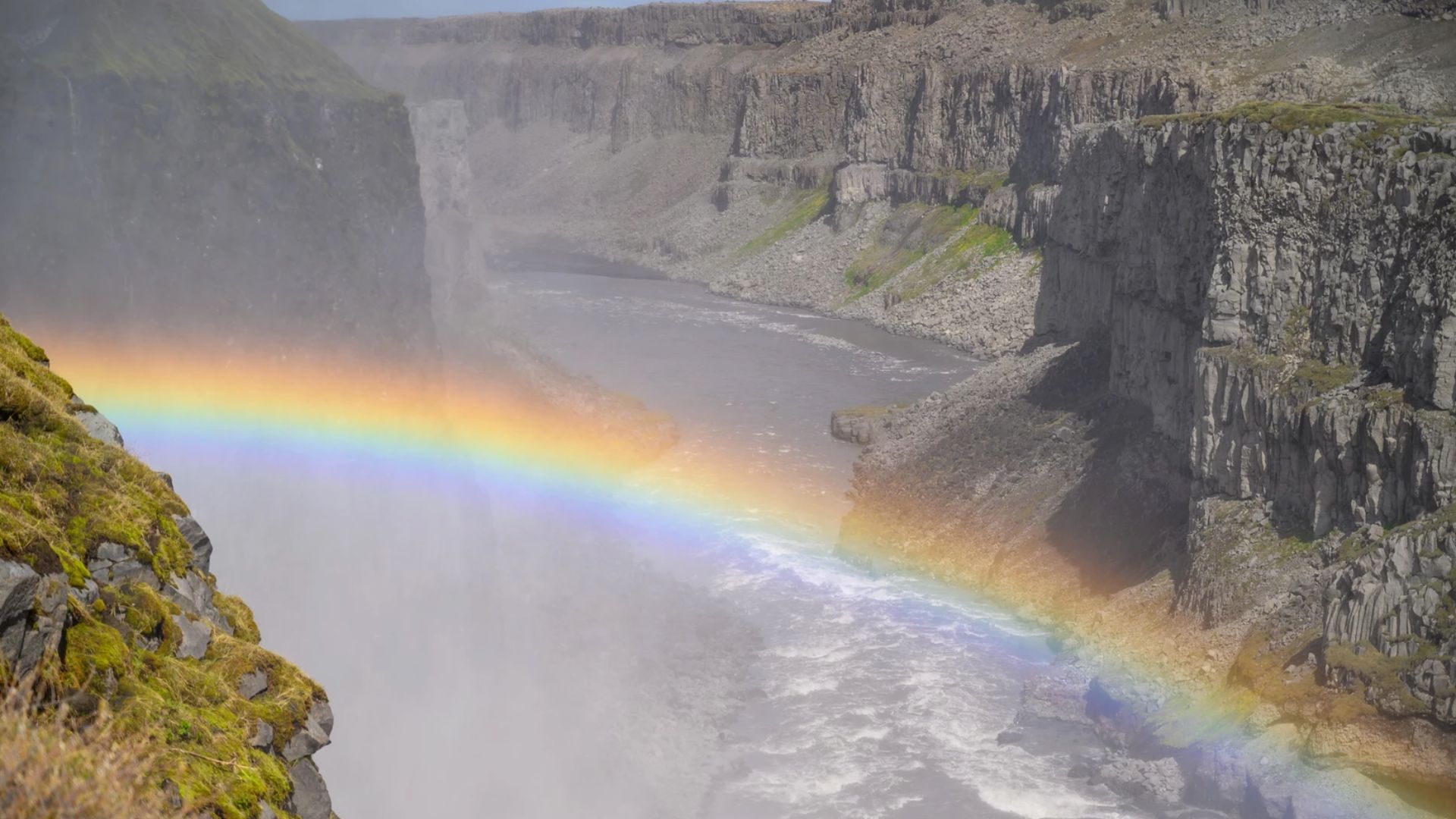 Dettifoss waterfall with rainbow in North Iceland