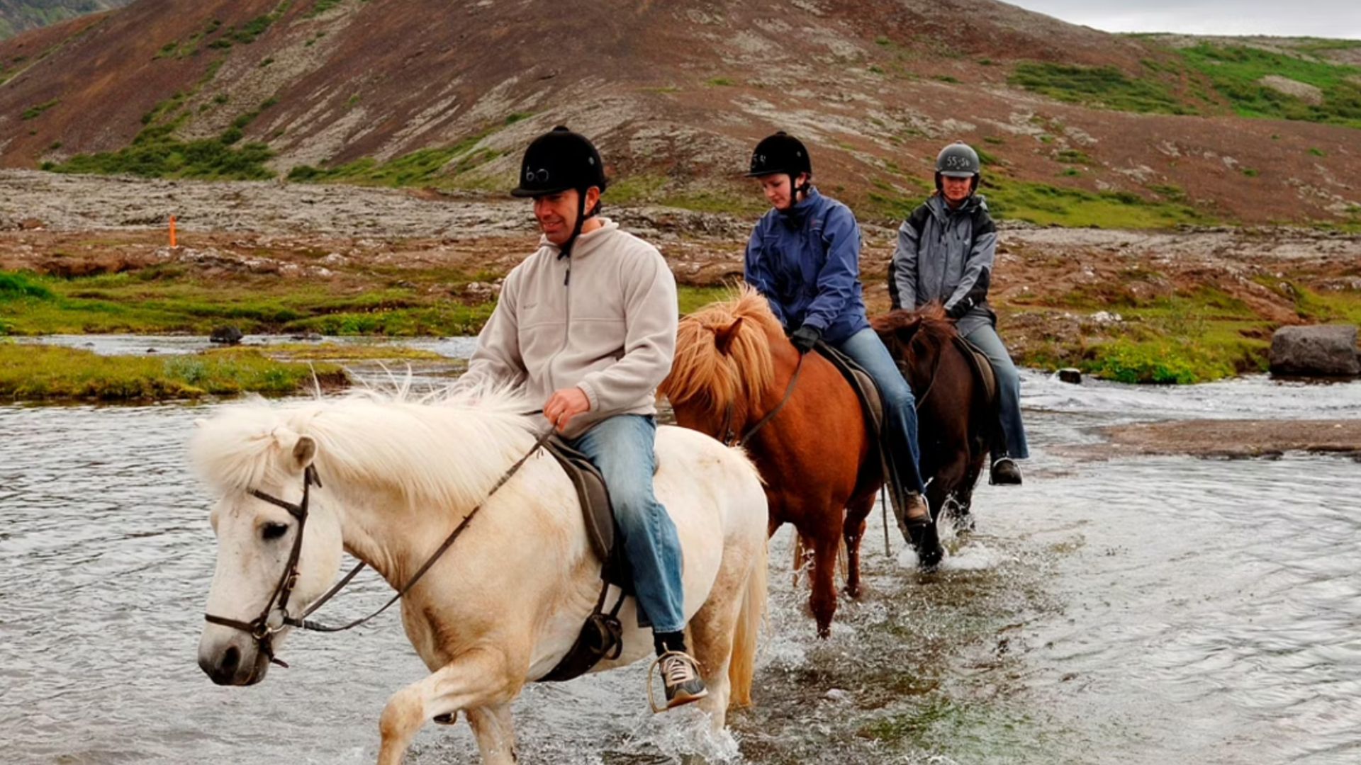 Crossing a river on a horse in Iceland