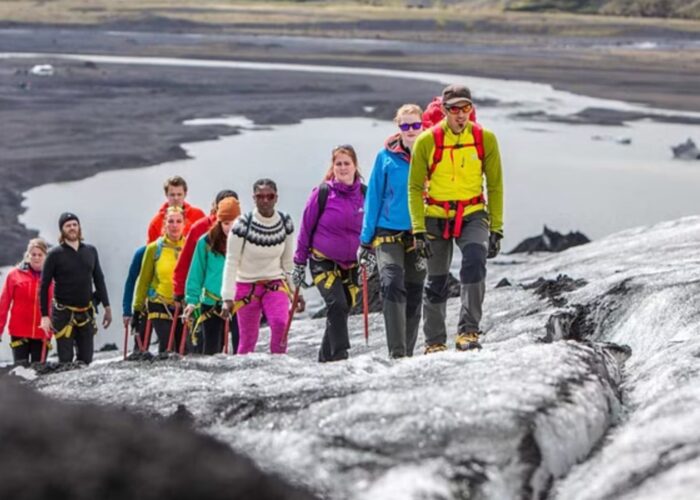 Tourists hiking on the glacier