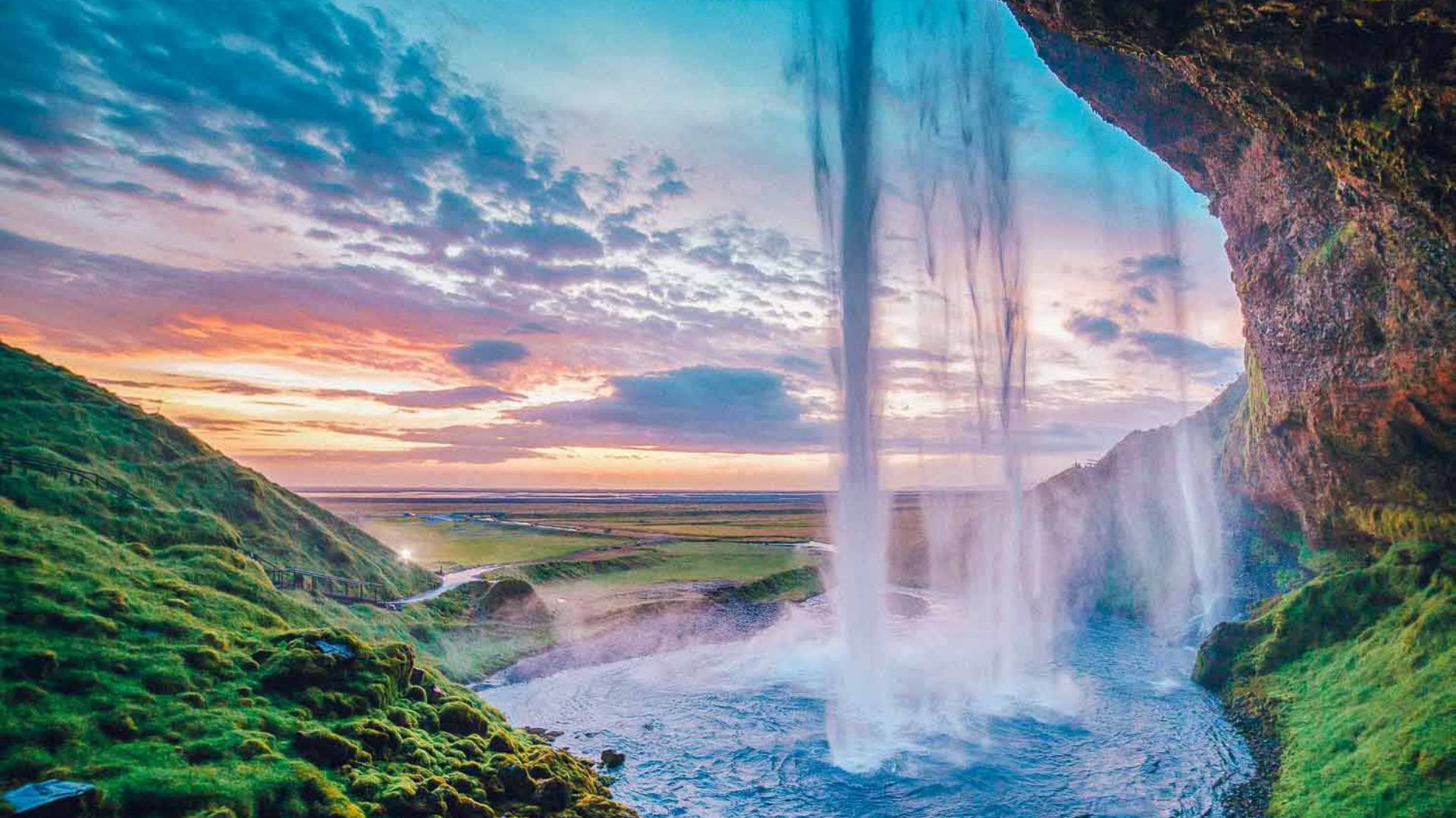 Seljalandsfoss is a famous Icelandic waterfall on the South Coast. You can walk behind this waterfall.
