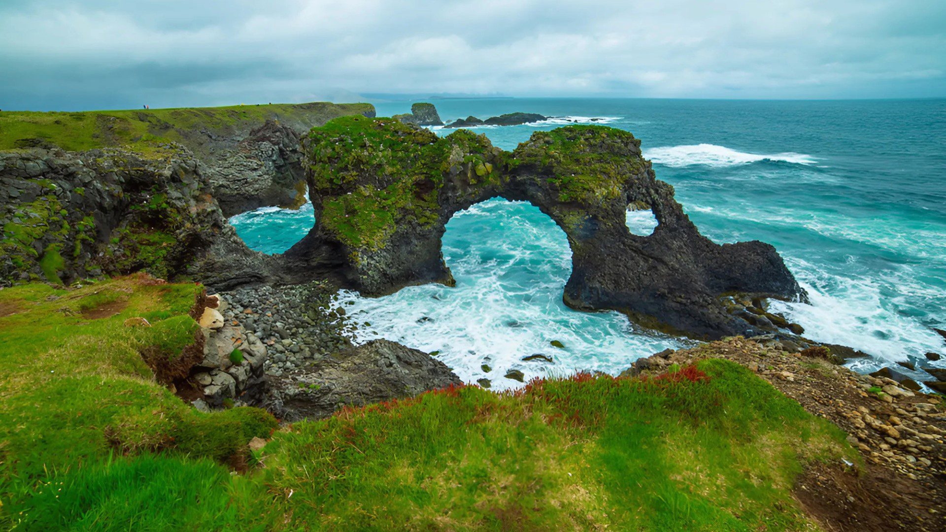 Private Bespoke Snæfellsnes The rugged coast at Arnarstapi, with its towering cliffs and sea stacks, offering a scenic and peaceful experience on the Private Bespoke Snæfellsnes tours.