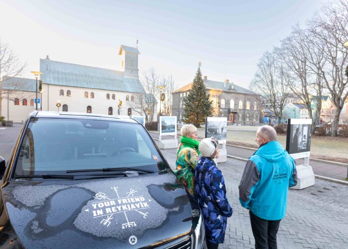 Travellers visiting a landmark in downtown Reykjavik