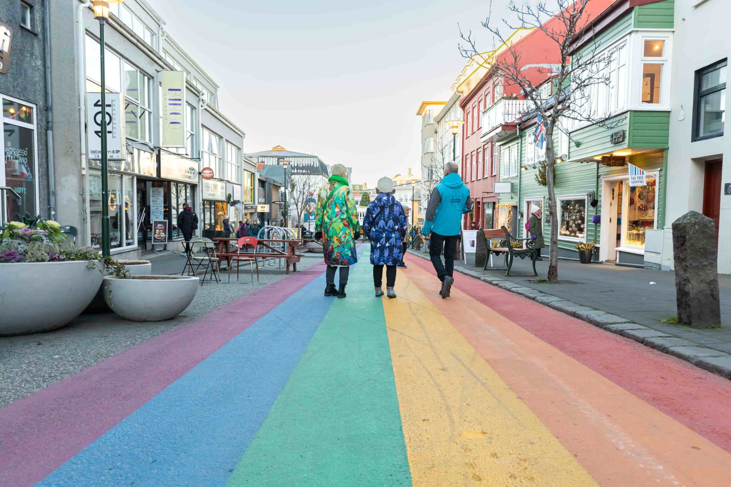 A group of travellers walking down the Rainbow Street in downtown Reykjavik