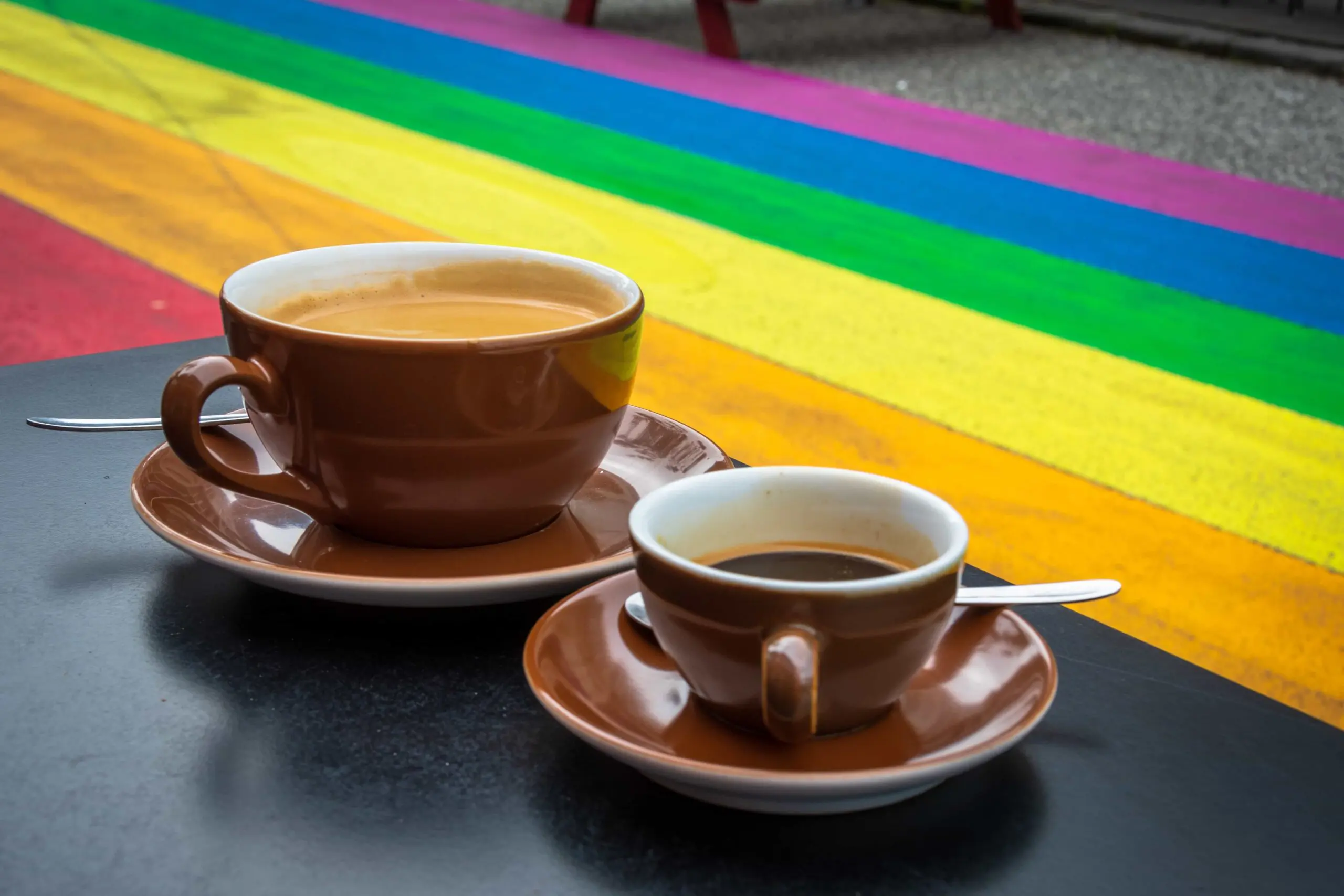 Two cups of coffee next to the Rainbow Street in Iceland