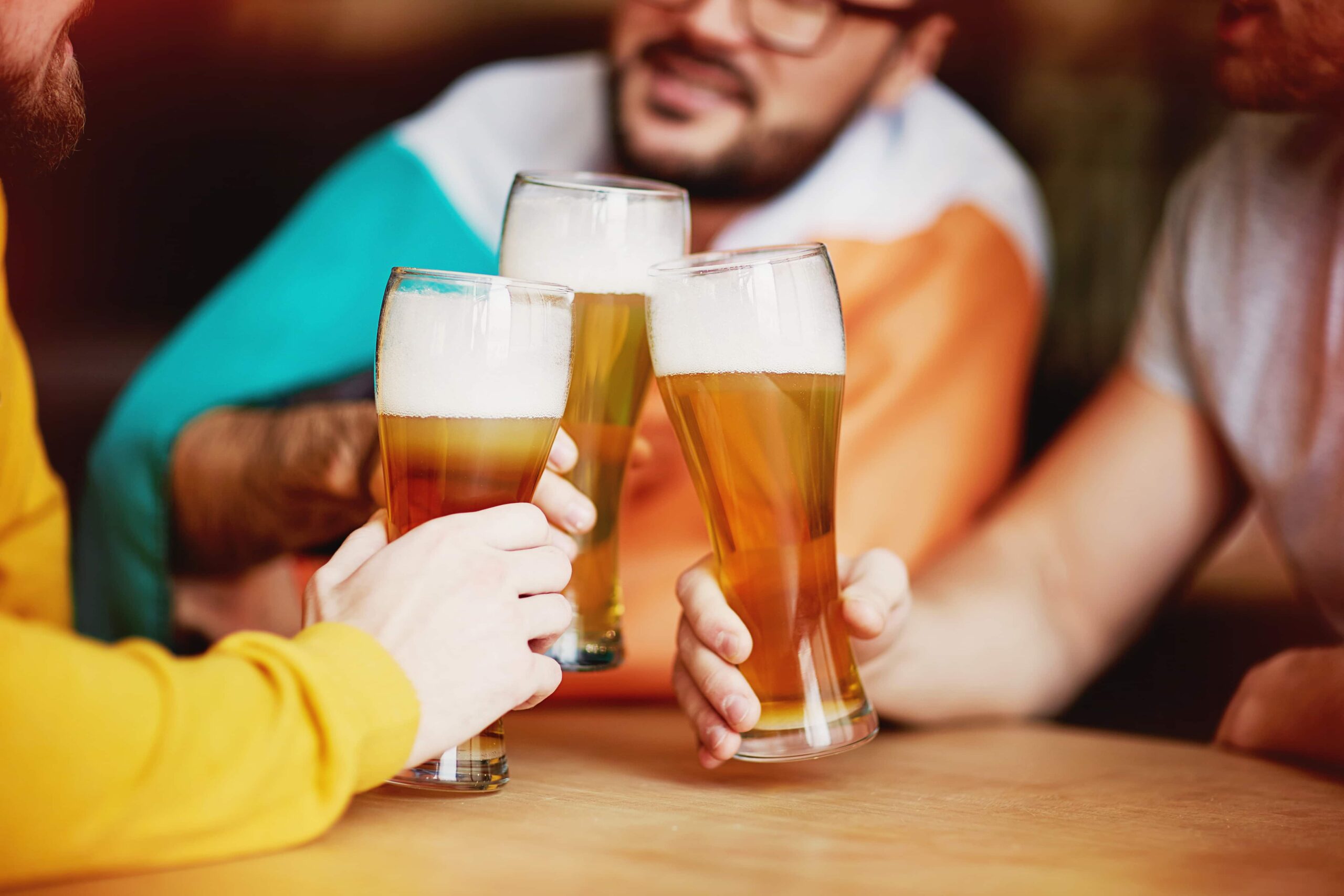 Travellers enjoying a beer together in a bar in Reykjavik