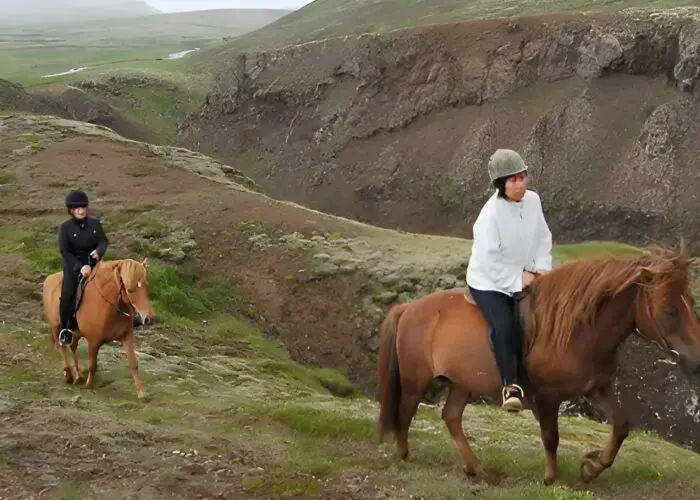People riding on horseback on the Golden Circle Adventure & Horseback Riding trip