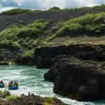 Two RIBs in a serene canyon on the Golden Circle & River Fun Rafting tour