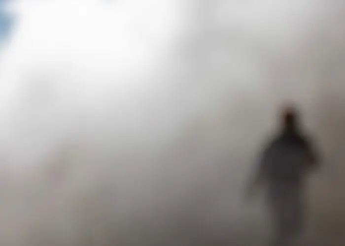 A ghostly figure emerges through the mist, setting the eerie atmosphere of the Reykjavik Midnight Sun Ghost Walk.