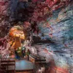 A group exploring the lava tunnel as seen on the Golden Circle & Lava Tunnel tour