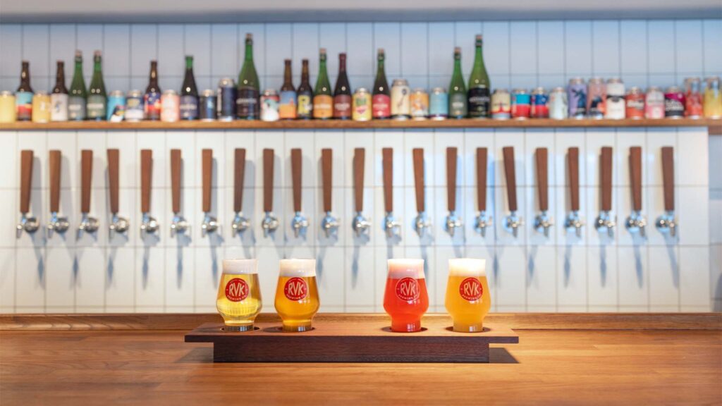 A taste platter of four beers from RVK Brewing Co, at Tónabíó. 22 taps in the background